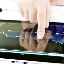 person touching graph on tablet